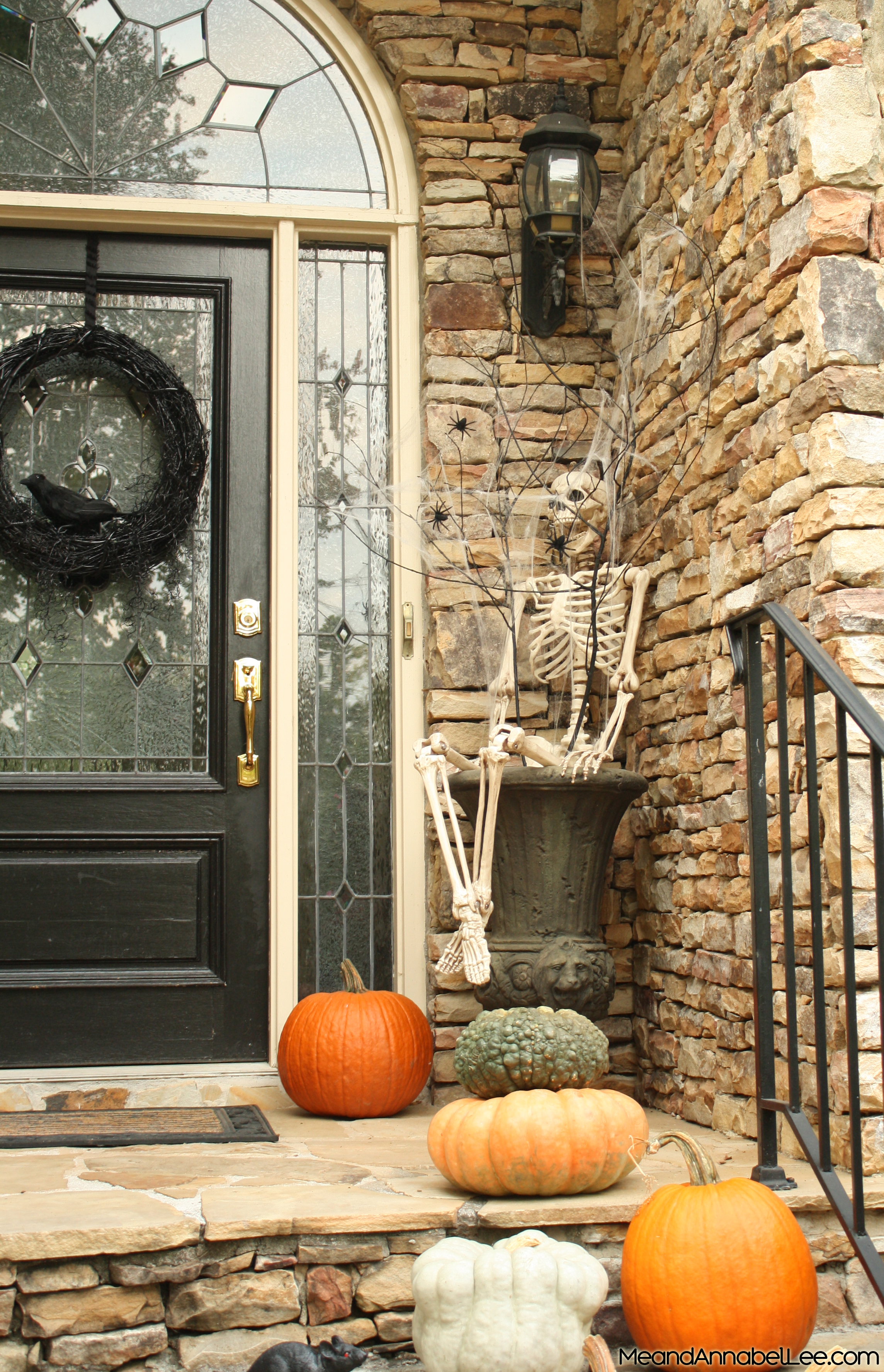Halloween Front Entry Decor - Skeletons, Pumpkins, Spider Web Branches, and Crow Grapevine Wreath - www.MeandAnnabelLee.com