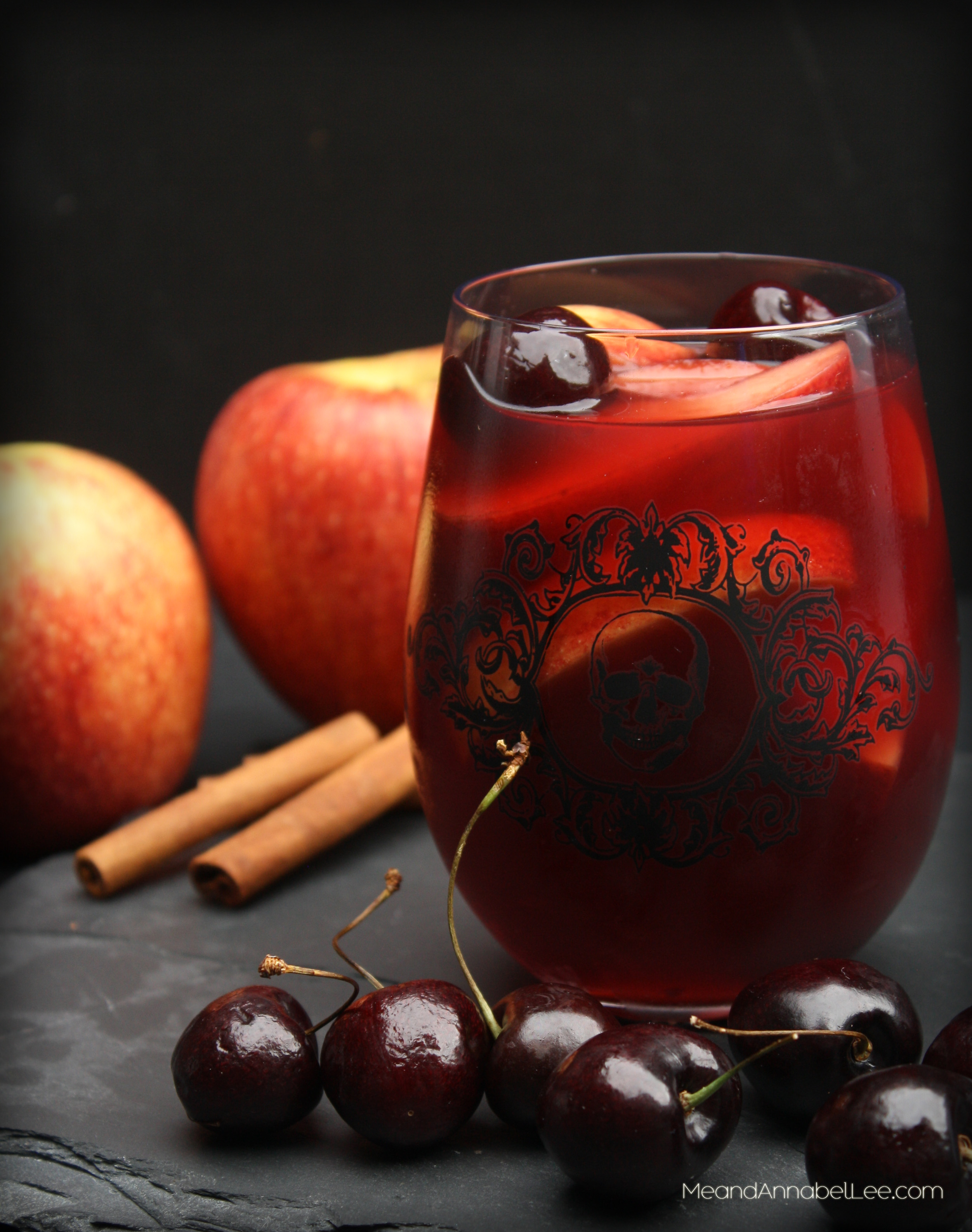 Apple Cherry Sangria....A mix of Envy Apples, Cinnamon, and Cherries make up this Fall inspired cocktail.... perfect for Halloween, Thanksgiving, or a Fall Party! - www.MeandAnnabelLee.com